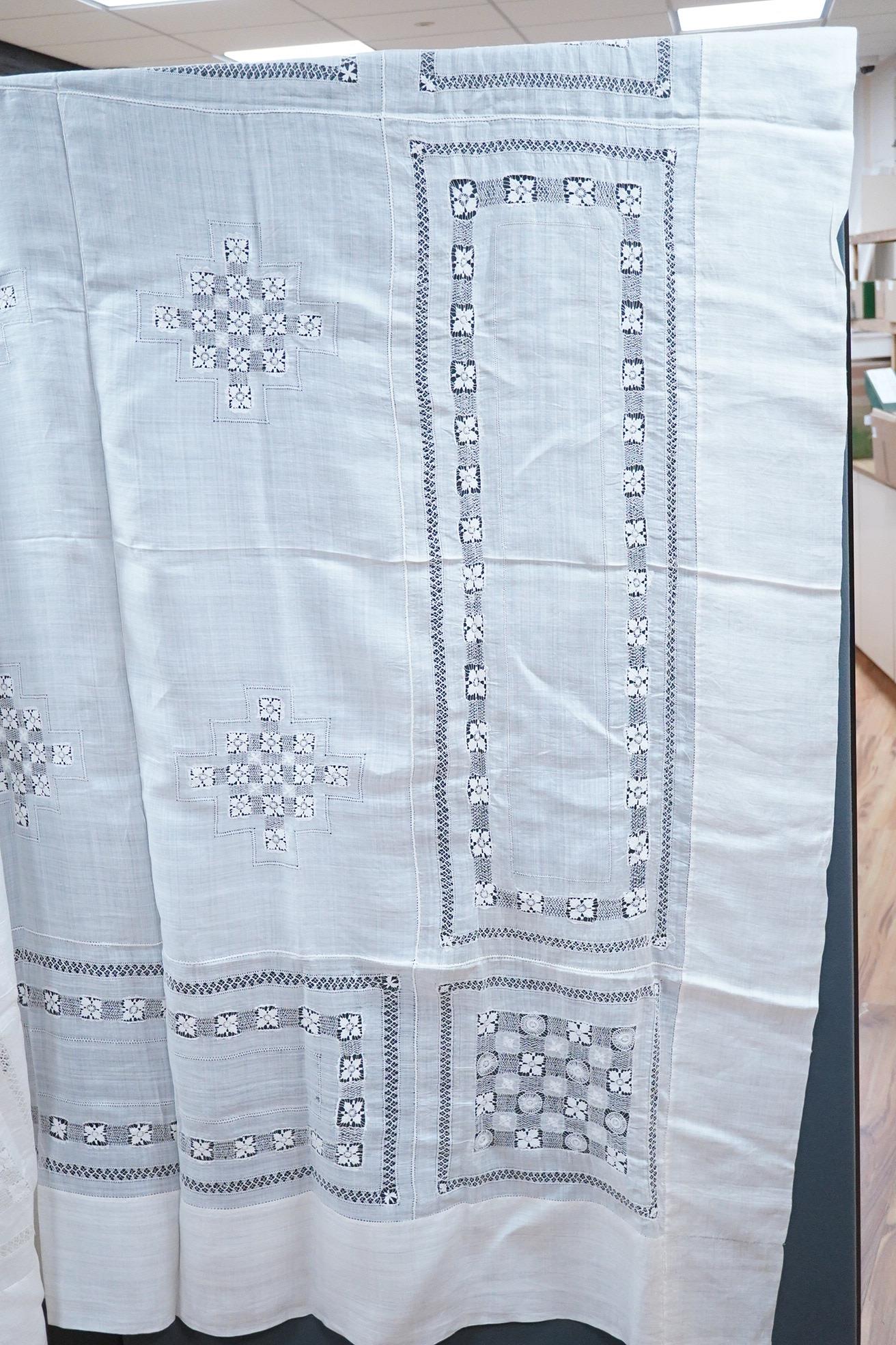 An ornate pineapple linen table cloth - 220cm x 190cm and a similar tea cosy, together with a collection of crochet edged, embroidered and cutwork table linens.